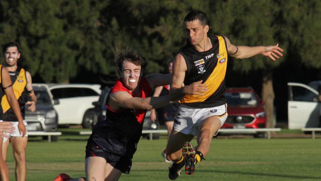 Red Cliffs Jonty Marciano in full flight kicking the ball to set up another goal against Mildura. He is now playing for Merbein. Picture: Glenn Milne