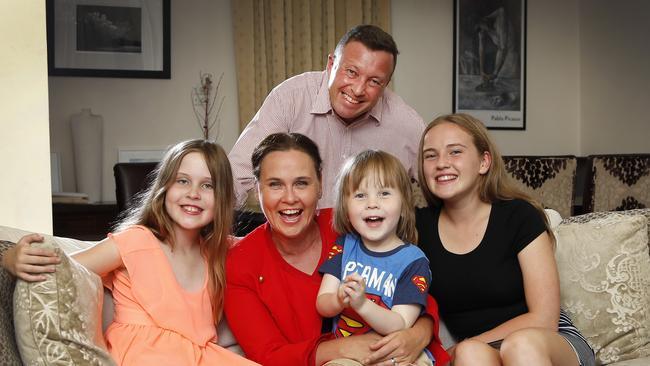 Jane Garrett at home with husband James Higgins and their children Sasha, Max and Molly. Picture: David Caird