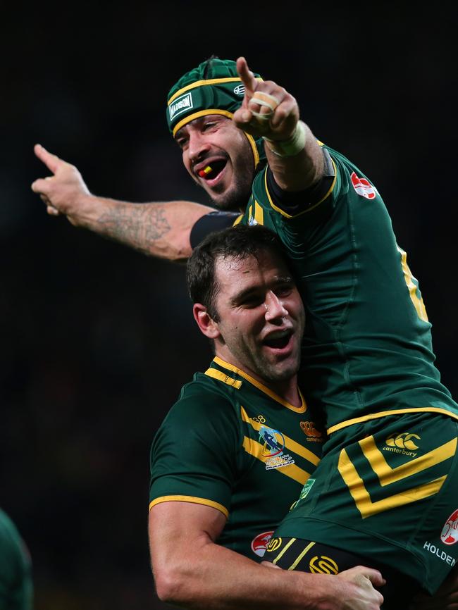 Johnathan Thurston and Cameron Smith celebrate after Australia’s victory over New Zealand in the Rugby League World Cup final in 2013. Picture: Alex Livesey/Getty Images