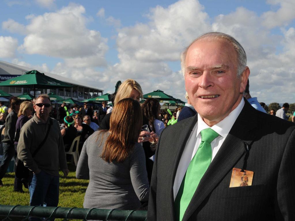 David Peacock chairman of the SAJC with crowd behind him at Morphettville Irish jumps day.