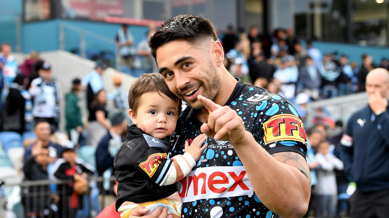 COFFS HARBOUR, AUSTRALIA - MAY 30: Shaun Johnson of the Sharks celebrates victory and his 200th NRL match with daughter Millah Johnson after the round 12 NRL match between the Cronulla Sharks and the Gold Coast Titans at C.ex Coffs International Stadium, on May 30, 2021, in Coffs Harbour, Australia. (Photo by Bradley Kanaris/Getty Images)