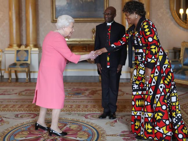 Just last week the Queen was pictured greeting dignitaries with a gloveless handshake. Picture: AFP