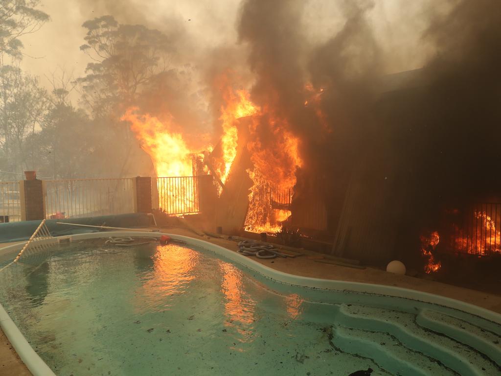 House is lost to the fire on Hassall rd, Bruxton. Bushfire surrounds the town of Buxton in the Southern Highlands as Rural Fire Service work to protect as many homes as they can. Picture: Rohan Kelly