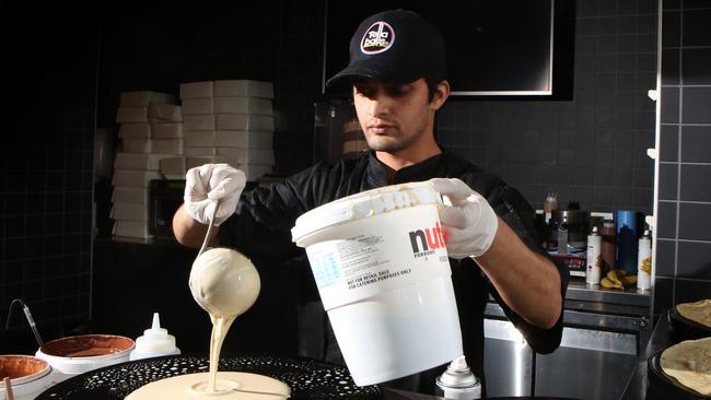 Chef Siddhant Paudyal cooks some desserts. Picture: Robert Pozo