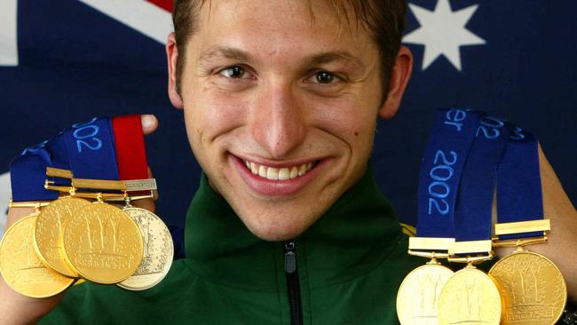 Aust swimmer Ian Thorpe holding 6 gold medals and one silver at 2002 Commonwealth Games