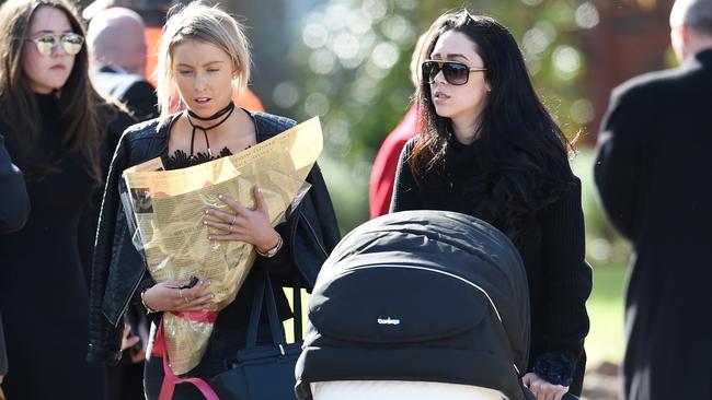 Danielle Stephens, right, the daughter of Roberta Williams, arrives at the funeral for Carl Williams’ father George Williams at Saint Therese's Parish in Melbourne. Picture: AAP