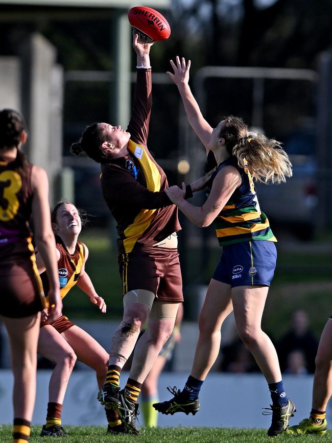 VAFA: Kew’s Lauralee Rinaldi and St Kevin’s Charity Russell contest the ruck. Picture: Andy Brownbill