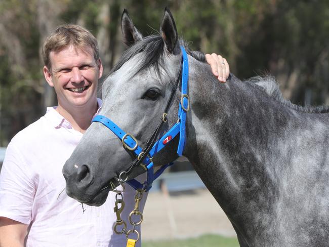 Trainer Bjorn Baker and The Wave hopeful ,Fun Fact, at Traintech stables at Bundall. Picture Glenn Hampson