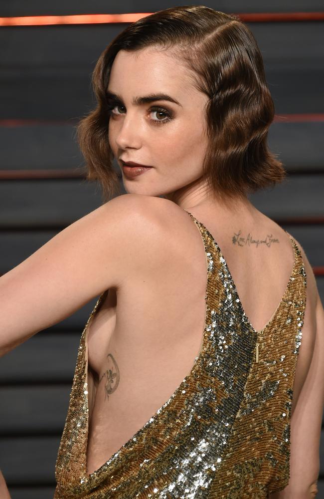 Lily Collins shows off some side boob at the Vanity Fair Oscar Party on Sunday, Feb. 28, 2016, in Beverly Hills, Calif. (Photo by Evan Agostini/Invision/AP)