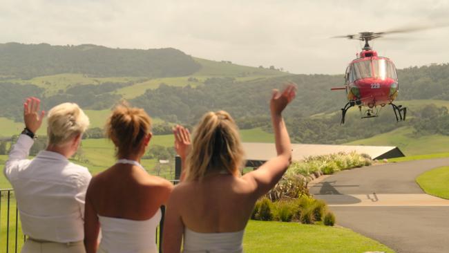 The cast farewell guests leaving the Billion Dollar Playground in a helicopter.