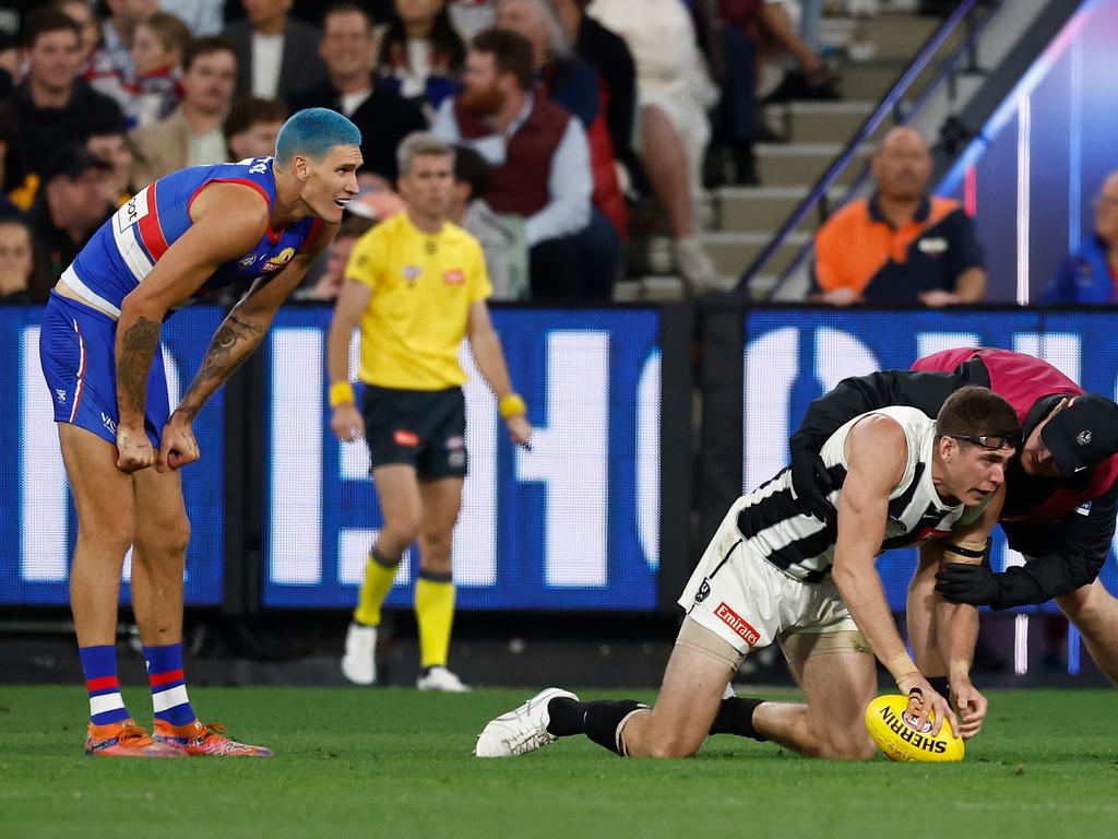 Mason Cox goes down after a hit from Rory Lobb. Picture: Getty Images