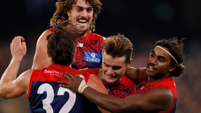 Bayley Fritsch (centre) celebrates a goal as the Demons keep their unbeaten run intact. Picture: Dylan Burns/AFL Photos via Getty Images