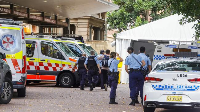 Ambulance officers and police outside the Royal Prince Alfred Hospital main entrance on Monday, January 10. Picture: Jenny Evans/Getty Images