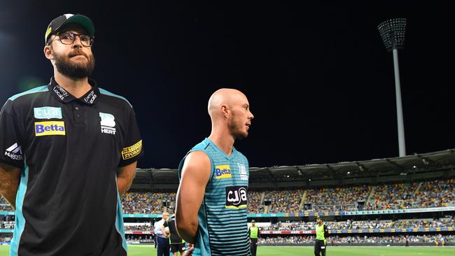 Brisbane heat coach Daniel Vettori (left) and captain Chris Lynn at the Gabba on Thursday night after the lights went out at the Stanley Street end. Picture: AAP 