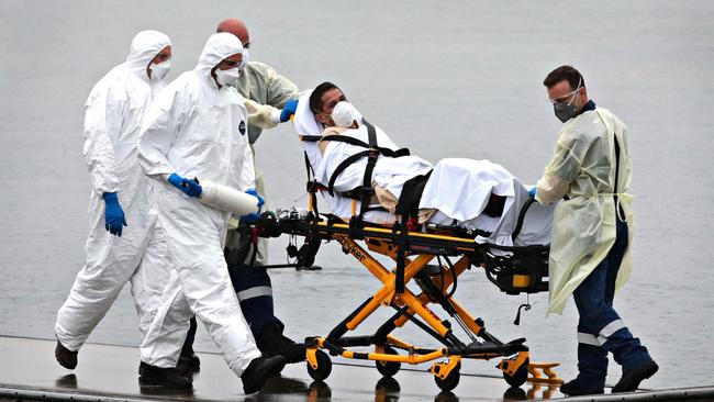 A Ruby Princess staff member is evacuated on April 2, 2020. Picture: Adam Yip/The Australian