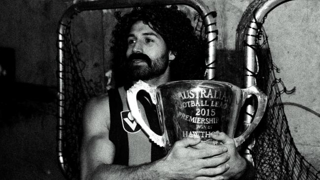 Paul Puopolo, as strongman Robert DiPierdomenico, cradles the 2015 premiership cup. 