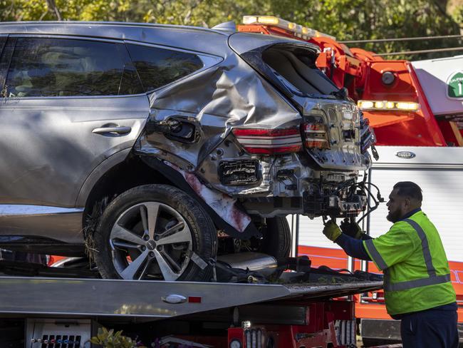 A tow truck operator secures the car that golf legend Tiger Woods was driving when seriously injured in a rollover accident on February 23, 2021 in Rolling Hills Estates, California. Picture: Getty