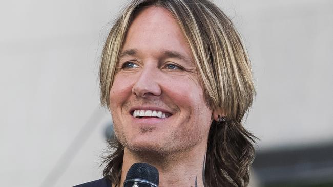 Caught short: A generous grandmother picked up the bill when Keith Urban was caught short a few dollars at a service station. Picture: Charles Sykes/Invision/AP