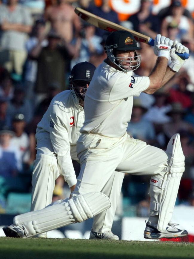 Steve Waugh hits a cover drive on the last ball of the day to bring up his century against England at the SCG in 2003. Picture: Mark Evans