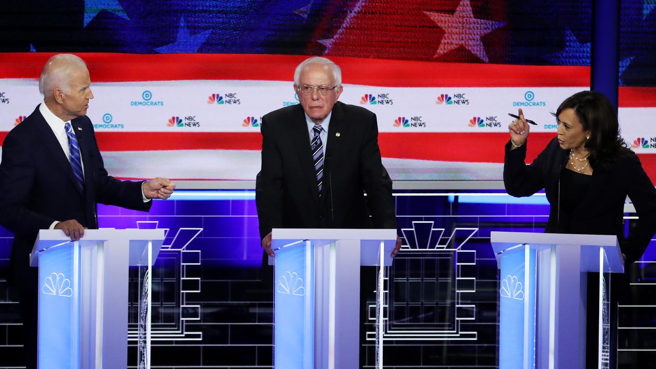 Meanwhile, old mate Bernie Sanders stood awkwardly in the middle. Picture: Drew Angerer/Getty Images/AFP