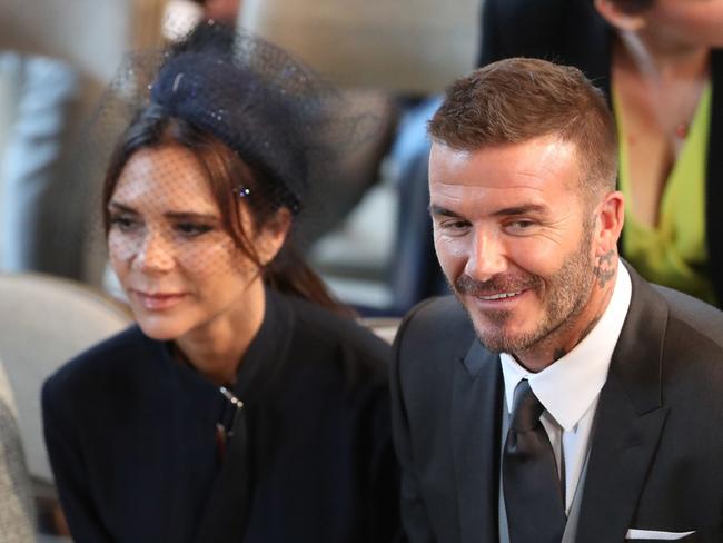 David and Victoria Beckham were all smiles at the royal wedding before things took a turn. Picture: AFP