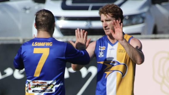 Two Mallee Eagles players celebrate a goal against Swan Hill earlier this season. Picture: Erin Scaresbrook