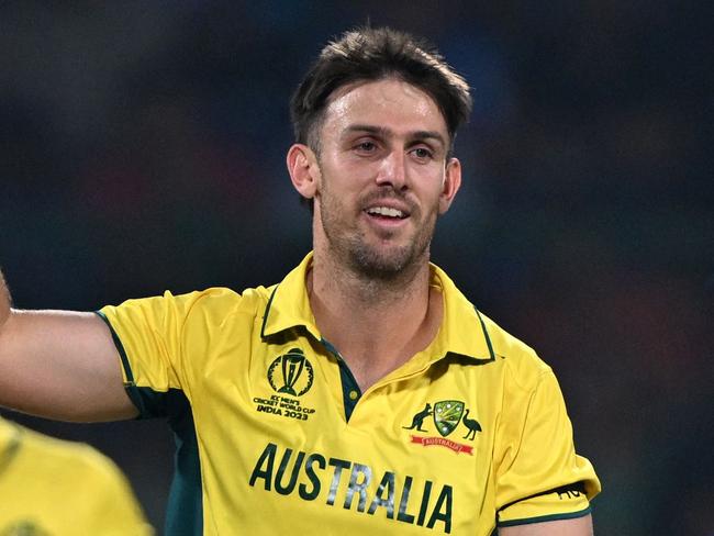 Australia's Mitchell Marsh (C) celebrates after taking the wicket of Netherlands' Teja Nidamanuru during the 2023 ICC Men's Cricket World Cup one-day international (ODI) match between Australia and Netherlands at the Arun Jaitley Stadium in New Delhi on October 25, 2023. (Photo by Arun SANKAR / AFP) / -- IMAGE RESTRICTED TO EDITORIAL USE - STRICTLY NO COMMERCIAL USE --