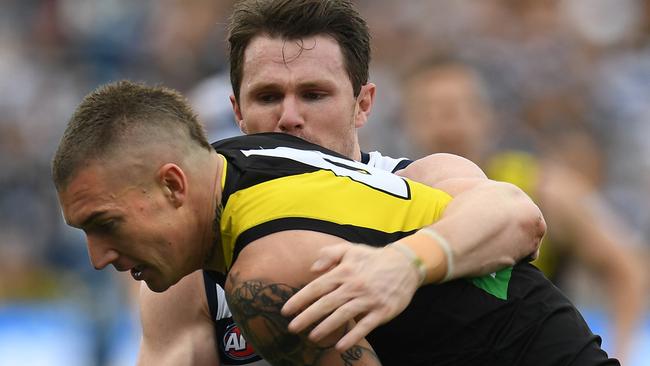 Dustin Martin is tackled by Patrick Dangerfield. Picture: AAP