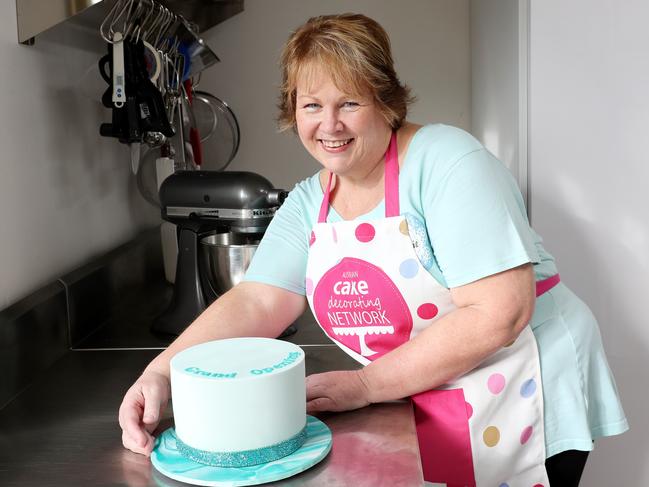 Ms Martens with one of her delicious cakes. Photo: Sue Graham