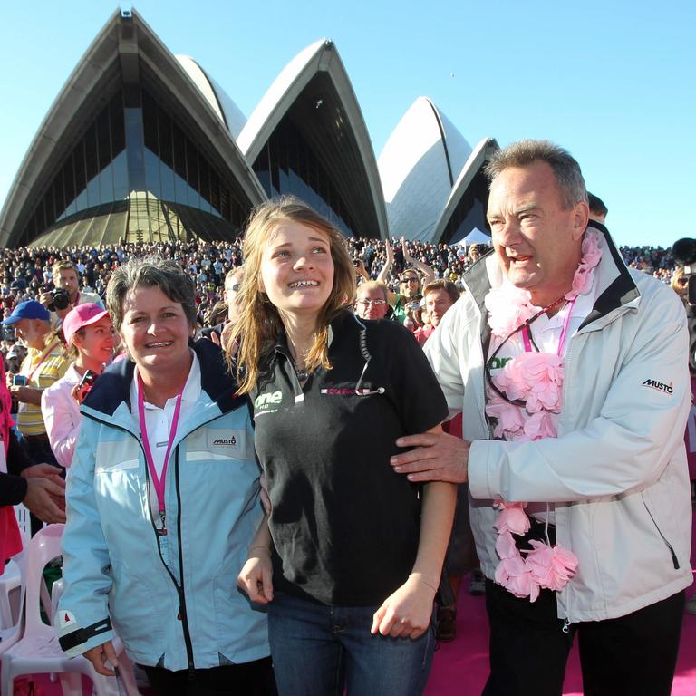 Sailor Jessica Watson (16) poses with her parents Julie and Roger having moored her yacht Ella's Pink Lady at Opera House in Sydney on completion and becoming the youngest to sail solo on a non-stop unassisted voyage around the World.