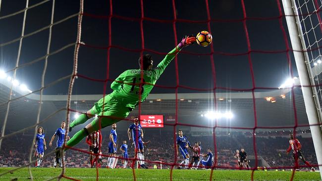 Thibaut Courtois of Chelsea saves a shot by Patrick van Aanholt.