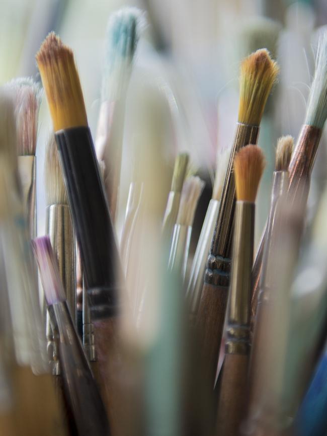 Romanian artist Dorina Petre teaches watercolour techniques for residents at social housing residence Link Housing in Ryde. Picture: Luka Kauzlaric