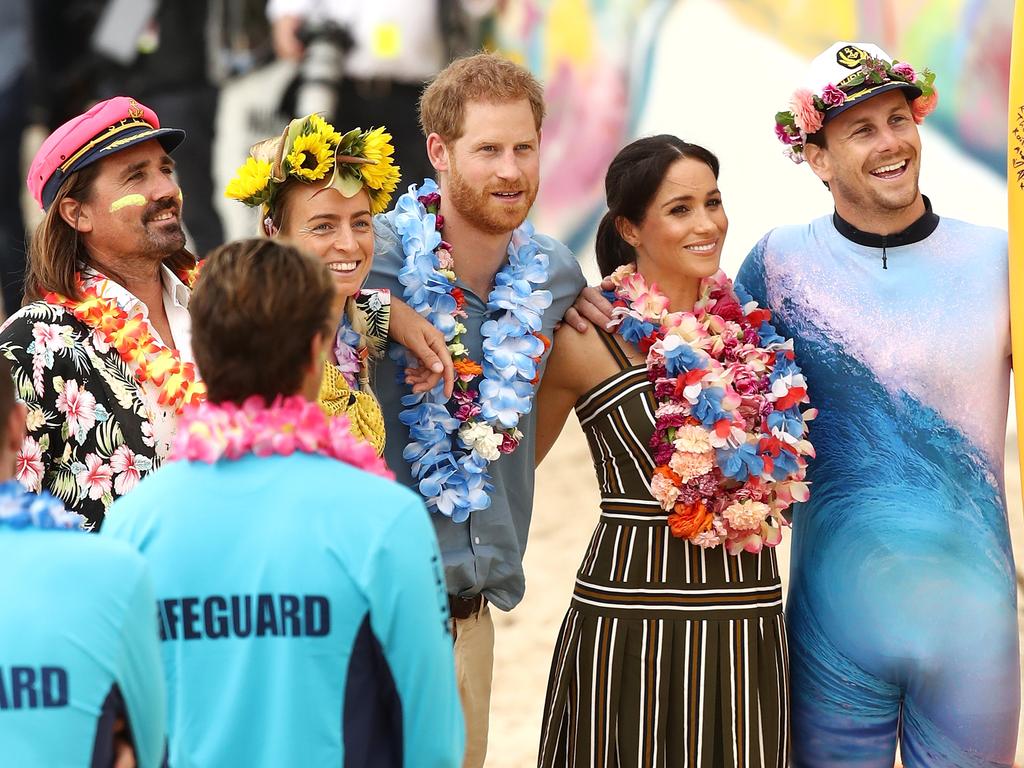 Prince Harry, Duke of Sussex and Meghan, Duchess of Sussex meet Grant Trebilco and Sam Schumacher, founder and co-founder of OneWave, a local surfing community group raising awareness for mental health and wellbeing and Bondi Lifeguards at Bondi Beach on October 19, 2018 in Sydney, Australia. Ryan Pierse/Getty Images