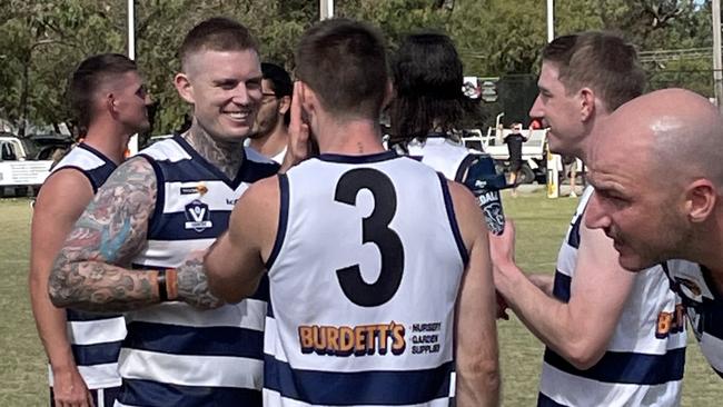 Dayne Beams has a laugh with Ryan Bastinac at quarter time.