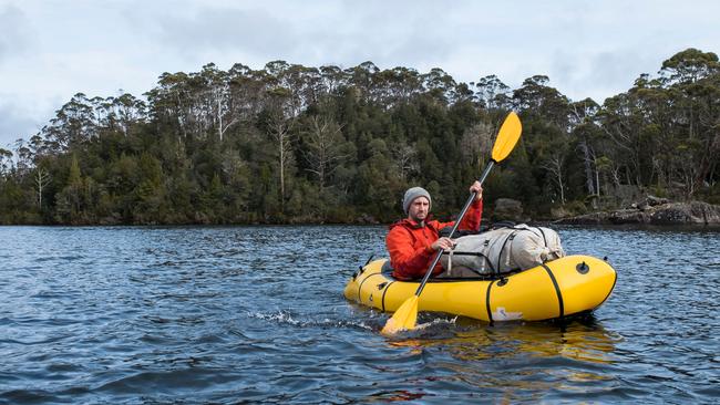 Walker and trout fisherman Richard Webb leaves Halls Island on Lake Malbena in the Walls of Jerusalem National Park and Tamsmania's World Heritage Area, where an exclusive fly-fishing eco resort has been proposed. Pictures: CHRIS CRERAR