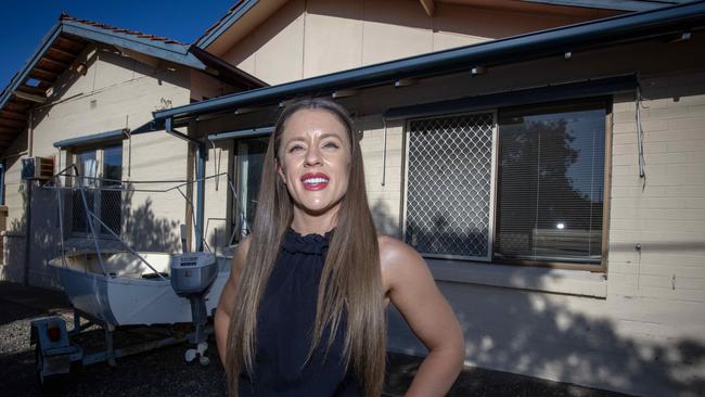 ADELAIDE, AUSTRALIA - Advertiser Photos FEBRUARY 15, 2023: Harcourts Packham Real Estate agent Cassandra Yeates outside the recently listed 19 bed, 4 bath at 51 Kauri Parade in Seacliff, SA. Picture Emma Brasier