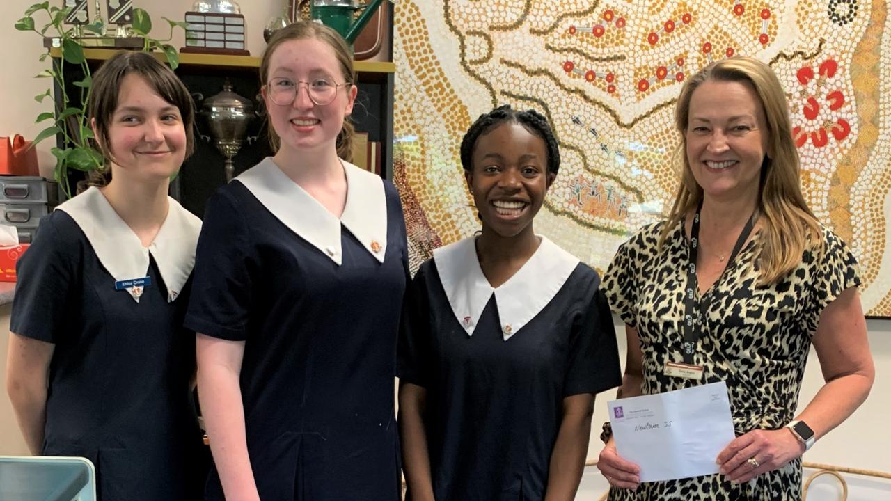 GLENNIE GIVES BACK: Glennie students have donated stationery and funds to a number of Toowoomba state schools as part of their SONDER program (from left) Khloe Crane, Hannah Stunden and Sandra Miller with Newtown State School principal, Mrs Tania Angus. Picture: Contributed