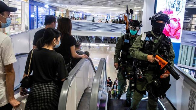 Riot police arrive for a clearance operation after district councillors protested inside a mall at Yuen Long in Hong Kong. Picture: AFP