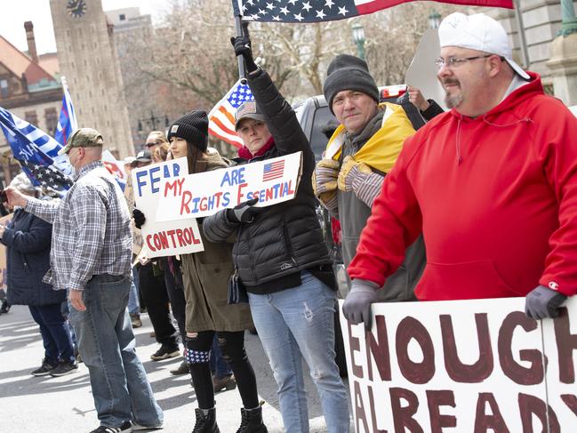 Demonstrators gather outside the New York State Capitol Building calling for businesses to reopen. Picture: AFP.