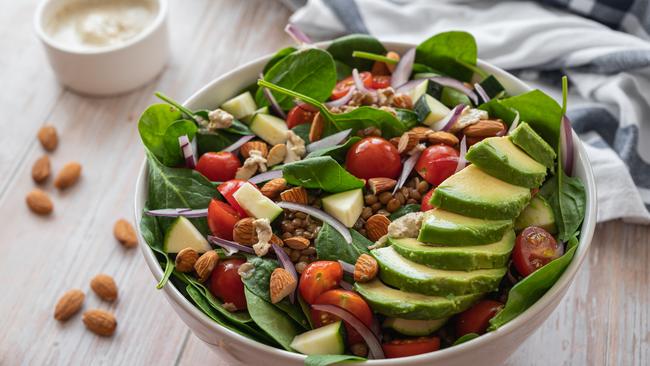 Fresh salad of spinach, onion and almonds. Picture: iStock