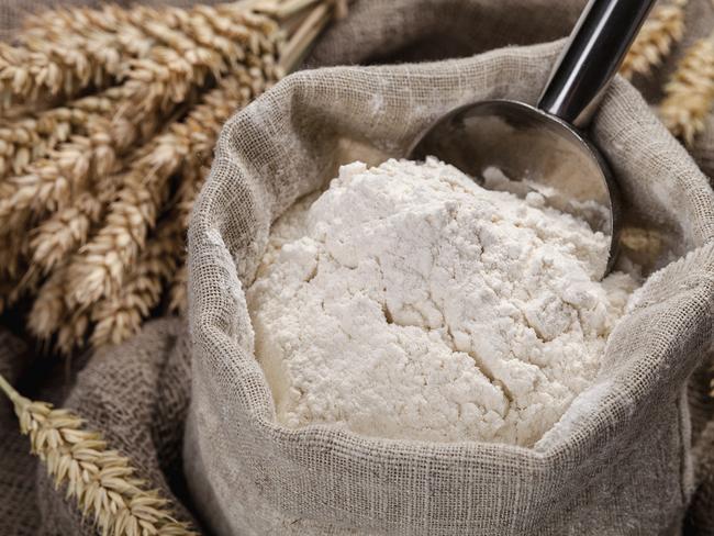 Flour in a bag on the table and spikelets ipad generic