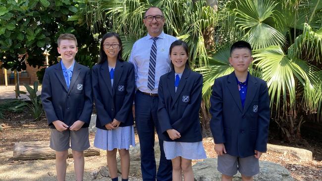 North Rocks Public School principal Robert Ieroianni with year 6 students Luke Brooks, Ashley Tu, Hannah Chung and Brian Lee.