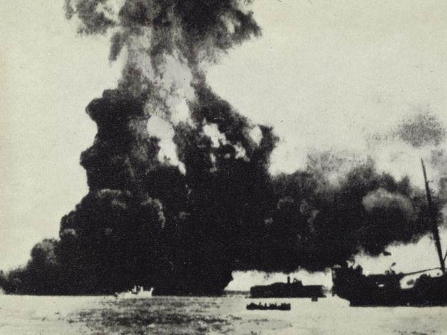 19 February 1942. The death of the Australian coastal traders Neptuna (hidden in smoke) and Zeelandia (right). Japanese bombing in Darwin. WWII - World War II - Australia - Air raids - 1942-1943.