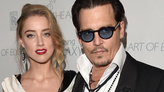 LOS ANGELES, CA - JANUARY 10: Actors Johnny Depp and Amber Heard attend the 8th Annual HEAVEN Gala presented by Art of Elysium and Samsung Galaxy at Hangar 8 on January 10, 2015 in Los Angeles, California. (Photo by Jason Merritt/Getty Images for Art of Elysium)