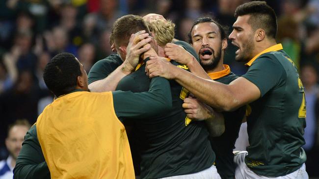 South Africa's players celebrate after scoring a try.