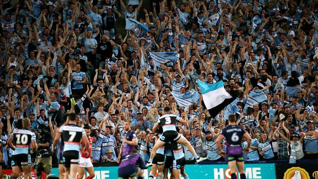 Sharks fans go crazy as the first try is scored. .2016 NRL Grand Final match between Melbourne Storm and Cronulla Sharks at the ANZ Stadium Homebush, Sydney, Australia on October 2, 2016. Picture: Colleen Petch.