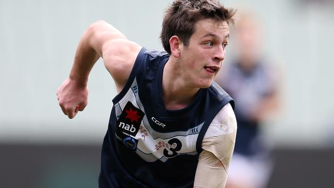 Zak Butters fires off a handball for Vic Metro in the 2018 under-18 championships. Picture: Michael Klein