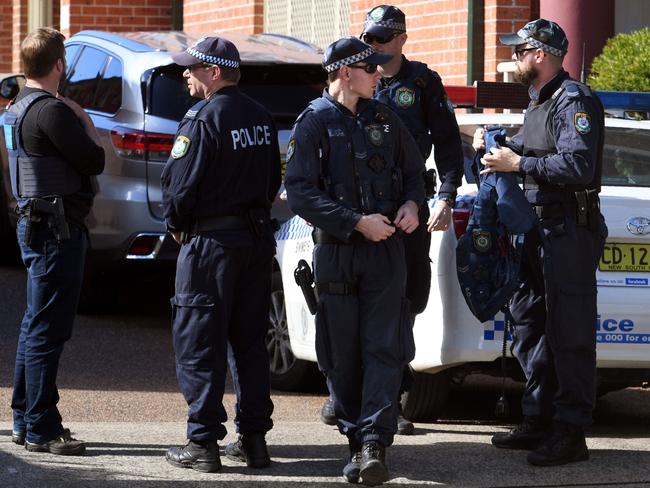 Police have four men in custody while they search homes following counter-terrorism raids across the city at the weekend. Picture: AFP PHOTO / WILLIAM WEST