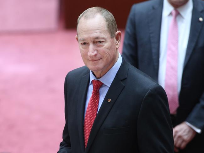 One Nation new Senator Fraser Anning defects after he was escorted into he chamber by Senators Cory Benardi and David Leyonhjelm. Picture Gary Ramage