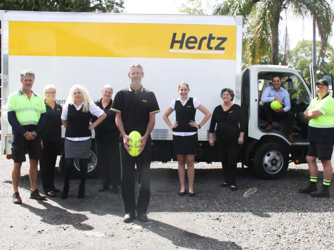 WIN WIN: At Hertz Northern Rivers, employees including Lismore Swans AFC senior men's team coach Ashley Prichard (centre) said his colleagues (L-R) Neil Jeffs, Judy Croker, Melanie Chambers, Madison Pethers, Julie Butler, Nathan Box and Christian War, are the "team behind the team" supporting local sporting clubs. Photo: Alison Paterson